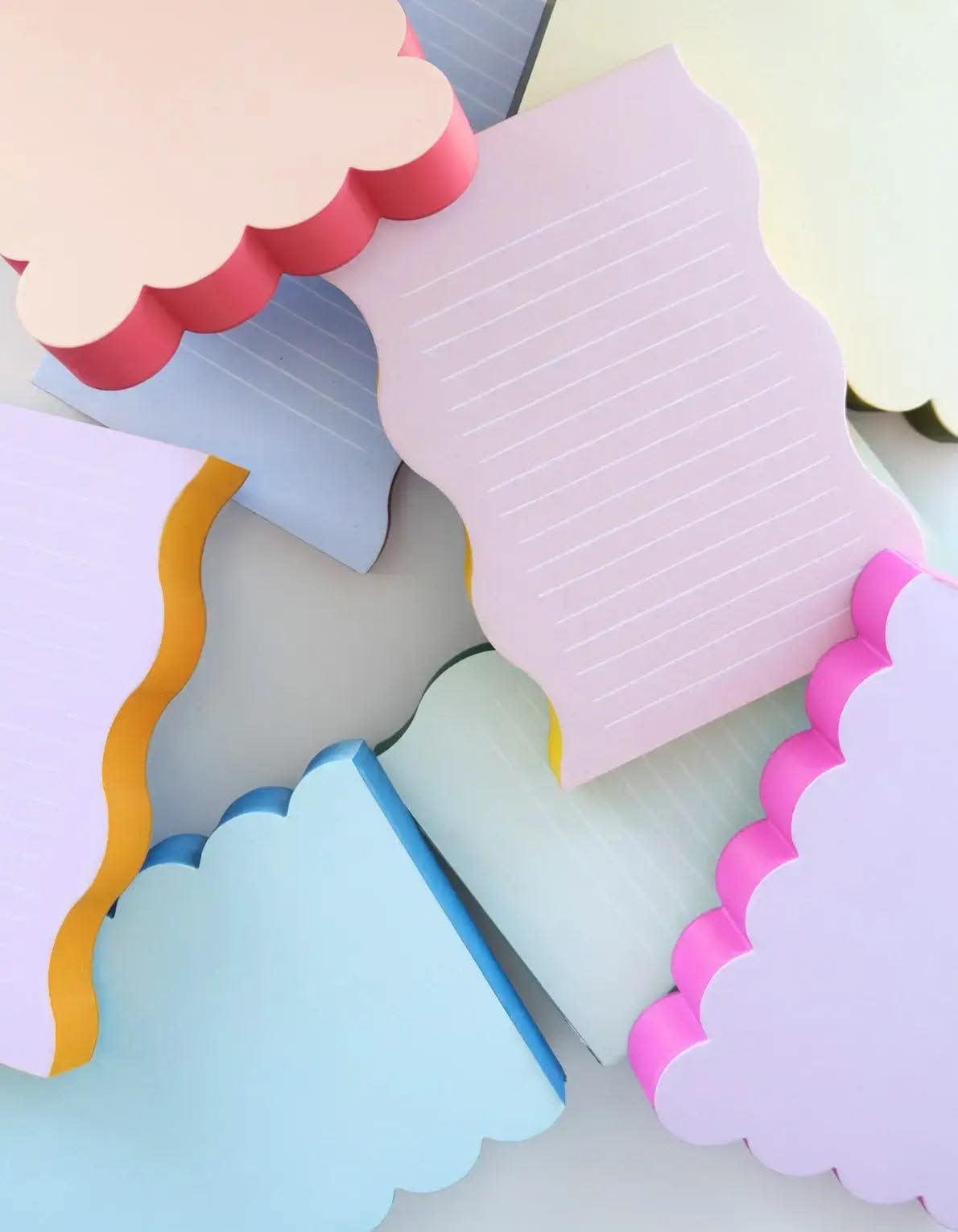 Pastel shaped memo pads in scalloped and wavy designs