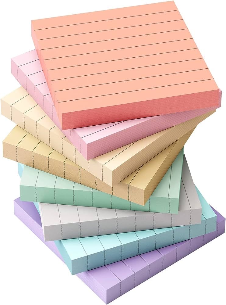 Stack of lined pastel notepad blocks